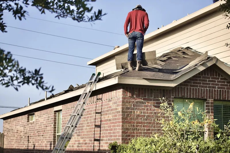 Professional roofer working on a residential roof in Hollywood Park